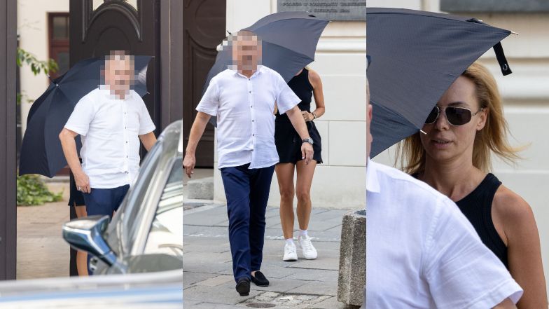 Izabela Janachowska zasłania się parasolem w drodze do samochodu