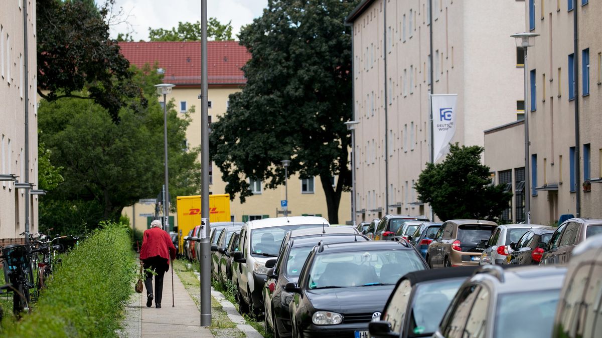 A pensioner outside residential apartment blocks on the Carl Legien modernist housing estate, operated by Deutsche Wohnen SE, in Berlin, Germany, on Monday, Aug. 2, 2021. Vonovia SE nudged up its offer for rival German real estate company Deutsche Wohnen SE to about 19.1 billion euros ($22.7 billion), sweetening an attempt to woo shareholders after last months bid narrowly failed. Photographer: Krisztian Bocsi/Bloomberg via Getty Images