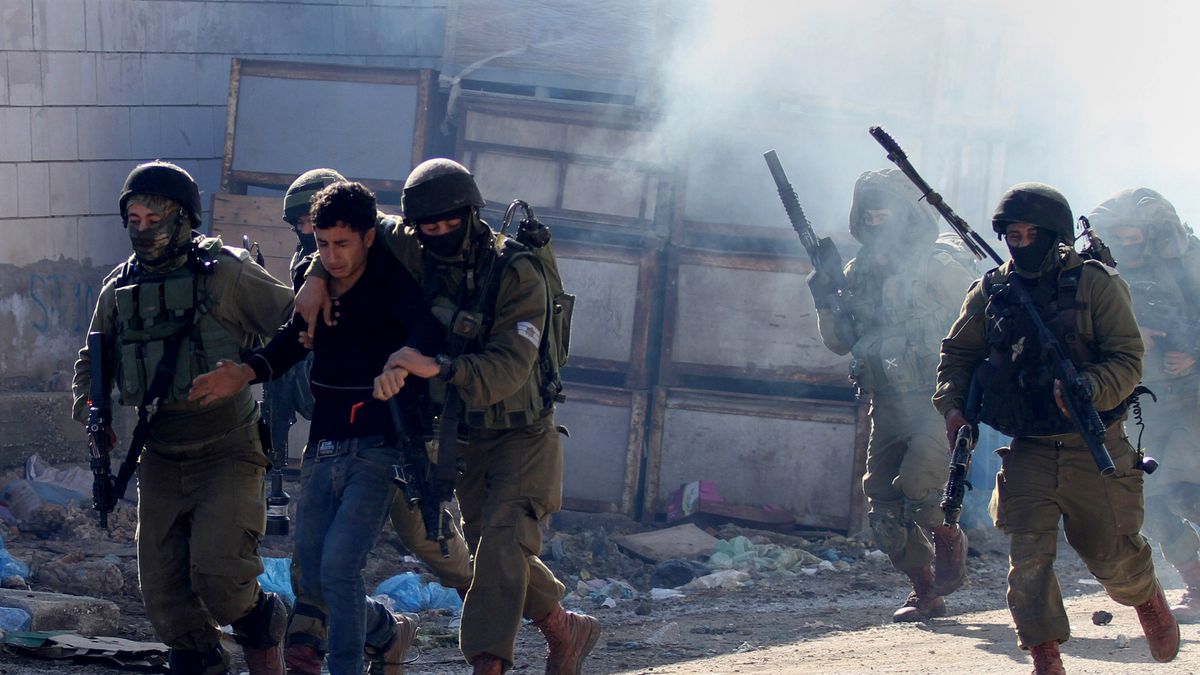 Protest in West Bank
JENIN, WEST BANK - FEBRUARY 4: Israeli security forces detain a Palestinian as Palestinians stage a protest against the shootings of three Palestinians on the ground that they attacked Israeli police in Jenin, West Bank on February 4, 2016.  (Photo by Nedal Eshtayah/Anadolu Agency/Getty Images)
Anadolu
West Bank, protest, 2016, Israeli soldiers, shootings, jenin, Palestinians, Israeli security forces