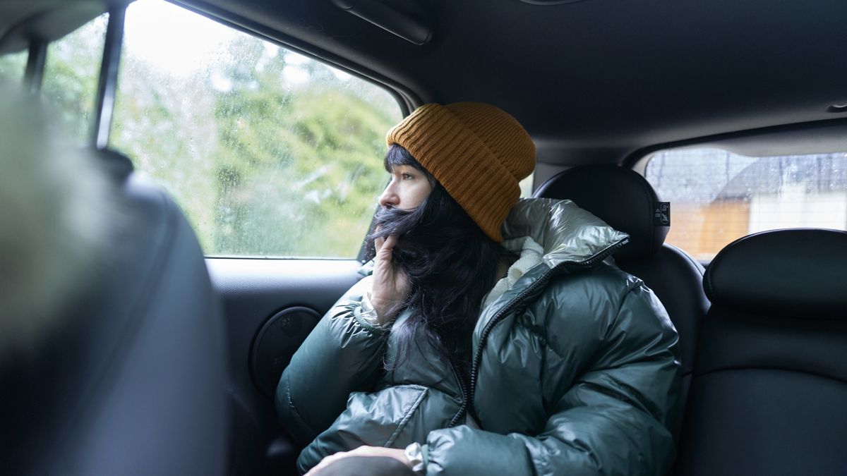 Sitting in back seat of car on cold winter rain day
Woman sitting in back seat of car on cold winter rain day
Kelly Mitchell