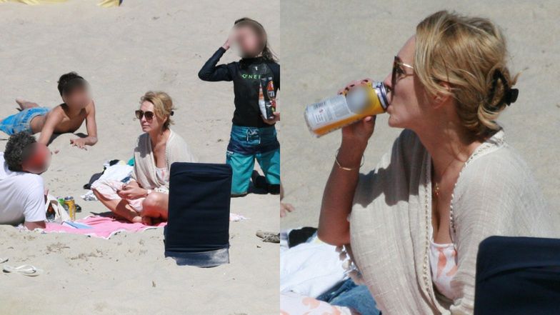 Anna Kalczyńska pije piwo na plaży i fotografuje pociechy
