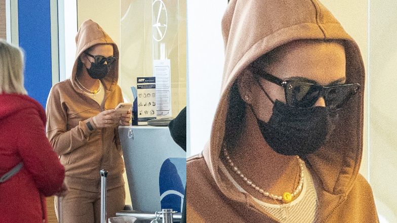 Sandra Kubicka w kapturze i okularach przeciwsłonecznych ukrywa się przed fanami (?) na lotnisku