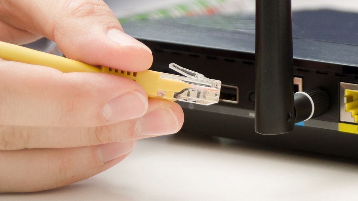 Man plugs Ethernet cable into routerMan plugs Ethernet cable into router. router wireless wire broadband home office cable plug conceptrouter, wireless, wire, broadband, home, office, cable, plug, switch, laptop, computer, wifi, technology, secure, ethernet, support, wan, network, plug-in, modern, telecommunication, internet, wi-fi, gateway, work, wlan, access, antenna, black, business, communication, connect, connection, data, digital, electronic, equipment, firewall, hardware, lan, mobile, speed, device, horizontal, male, man, on-line, person, router, wireless, wire, broadband, home, office, cable, plug, switch, laptop, computer, wifi, technology, secure, ethernet, support, wan, network, plug-in, modern, telecommunication, internet, wi-fi, gateway, work, wlan, access, antenna, black, business, communication, connect, connection, data, digital, electronic, equipment, firewall, hardware, lan, mobile, speed, device, horizontal, male, man, on-line, person