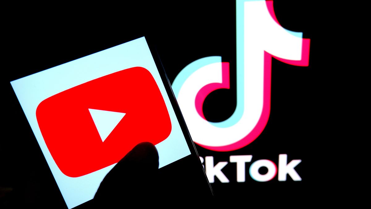 INDIA - 2022/10/27: In this photo illustration, a Youtube logo is displayed on a smartphone with a Tiktok logo in the background. (Photo Illustration by Avishek Das/SOPA Images/LightRocket via Getty Images)