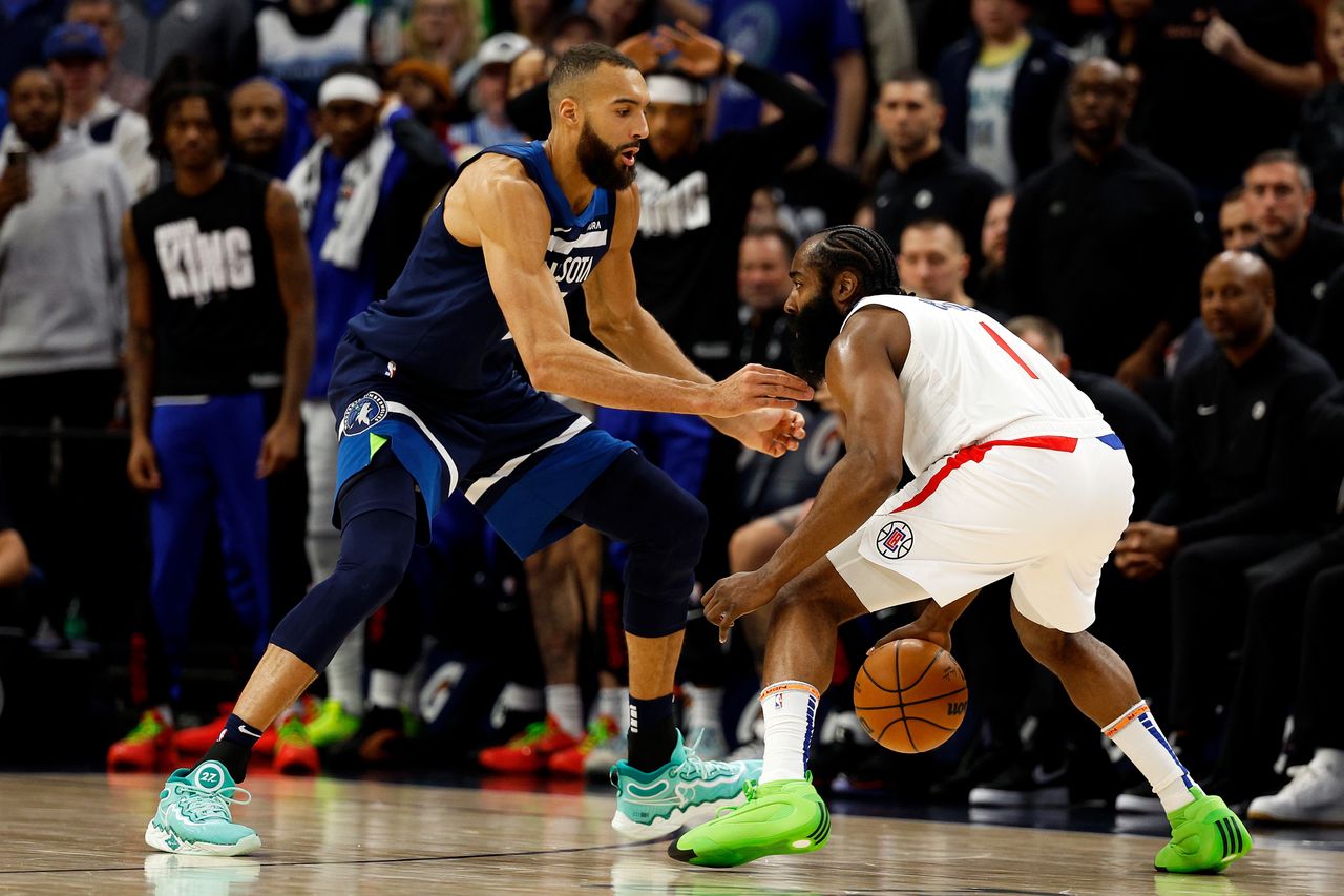 MINNEAPOLIS, MINNESOTA - JANUARY 14: James Harden #1 of the LA Clippers dribbles the ball against Rudy Gobert #27 of the Minnesota Timberwolves in the fourth quarter at Target Center on January 14, 2024 in Minneapolis, Minnesota. The Timberwolves defeated the Clippers 109-105. NOTE TO USER: User expressly acknowledges and agrees that, by downloading and or using this photograph, User is consenting to the terms and conditions of the Getty Images License Agreement. (Photo by David Berding/Getty Images)