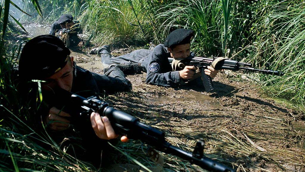 Russia - Kaskad Military Unit - Cadets practicing commando attack techniquesMembers of the elite marines group later destined to join Spetsnaz (Russian special forces). Here practicing a commando attack in the marshland close to the camp. In 1982, facing mounting casualties among inexperienced conscripts in Afghanistan, an experimental military unit (Kaskad) was set up where young troops were learning survival skills, shootings, and-to-hand combat. The war in Afghanistan is over but Kaskad still exists and many other camps have mushroomed. Since 1982, 8000 children have passed through Kaskad alone. (Photo by Arne Hodalic/Corbis via Getty Images)Arne Hodalicchild:CB1, summer camp:CB1, United States Marine Corps:CB1, commando:CB1, marsh:CB1, water:CB1, soldier:CB1, special forces:CB1, summer:CB1, teenager:CB1, recruit:CB1, Zhukovsky:CB2, Soviet Union:CB1, training:CB1