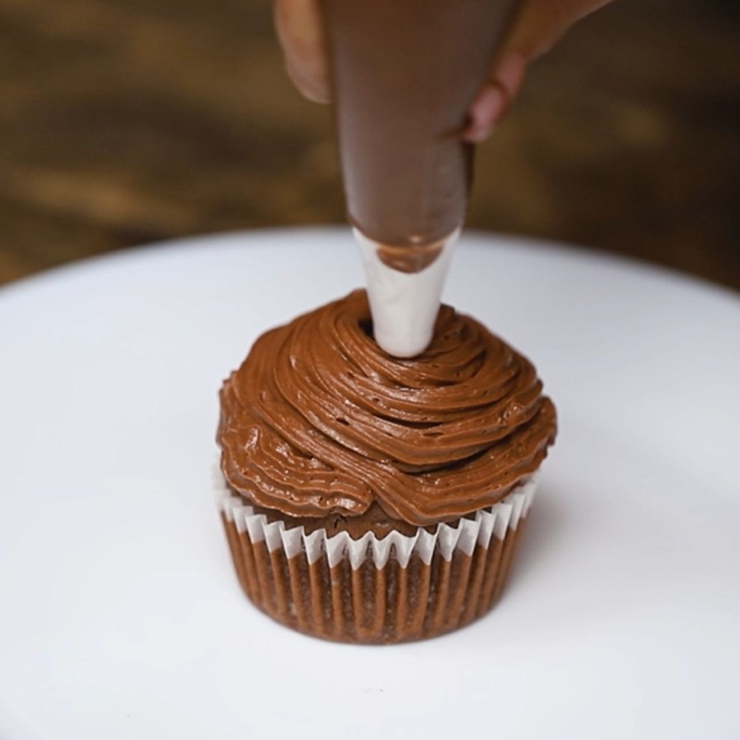 I decorate cupcakes using a pastry bag.