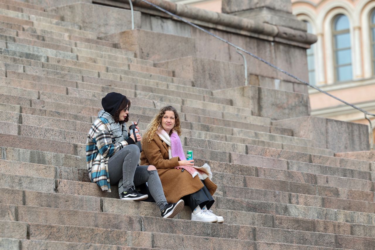 HELSINKI, UUSIMAA, FINLAND - 2024/03/10: Women sit on the steps in front of Helsinki Cathedral. (Photo by Takimoto Marina/SOPA Images/LightRocket via Getty Images)