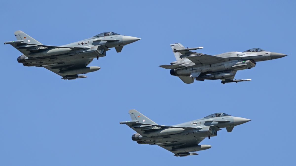 WARSAW, POLAND  AUGUST 15:
A Polish Air Force General Dynamics F-16CJ Fighting Falcon, accompanied by two German Air Force Eurofighter EF-2000 Typhoon jets, soars over Warsaw during the Armed Forces Day parade, commemorating Poland's 1920 victory over the Soviet Red Army and marking the 105th anniversary of the Battle of Warsaw, on August 15, 2025.
The event featured more than 4,000 Polish troops, about 200 soldiers from allied NATO nations, around 300 military vehicles, and nearly 50 aircraft, making it the largest parade in the country's history. (Photo by Artur Widak/NurPhoto via Getty Images)