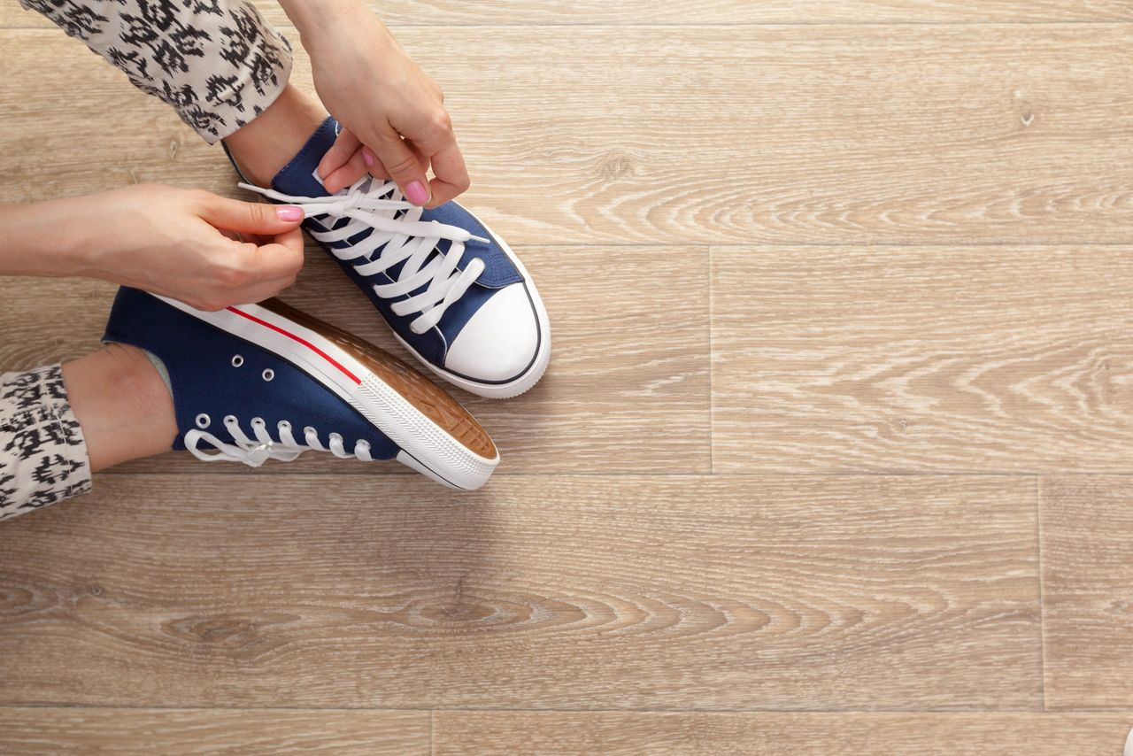 Woman tying shoelaces