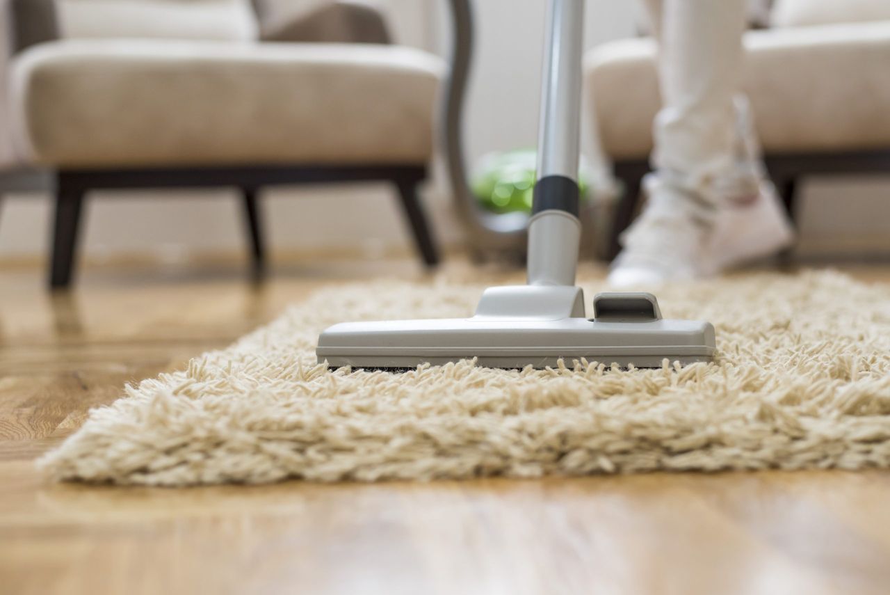 A closeup of a vacuum cleaner at a living room