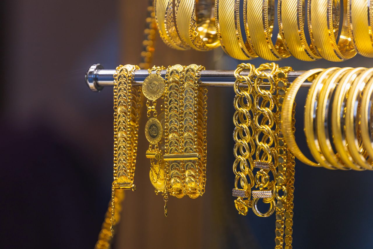 Jewelry shop window with a huge selection of gold jewelry bracelets, chains