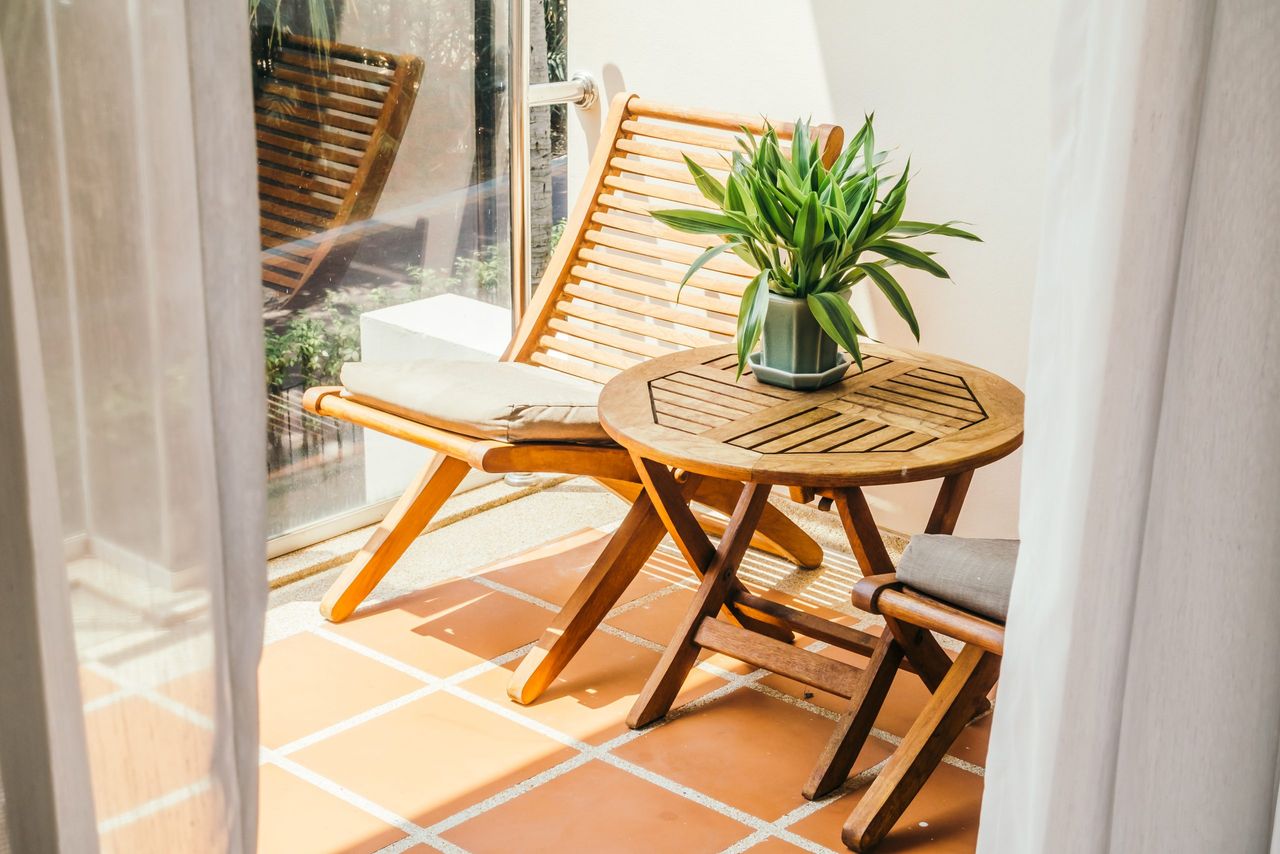 Empty chair and table around outdoor deck - Vintage Light Filter