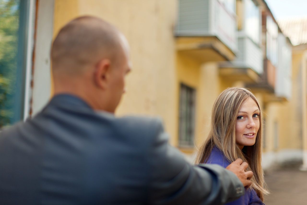 Man trying to get acquainted with a woman on the street