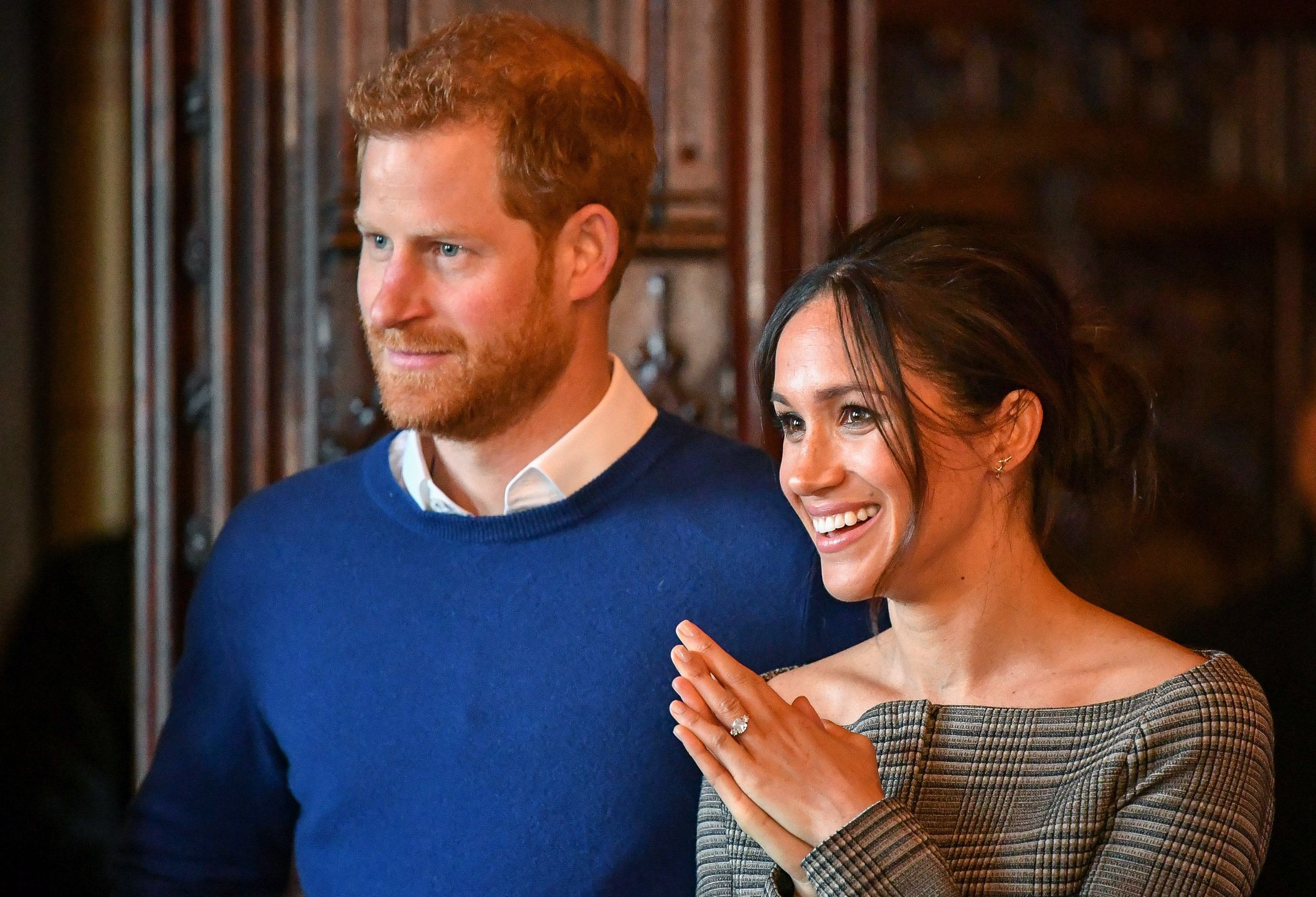 Prince Harry and Meghan Markle watch a performance by a Welsh choir in the banqueting hall during a visit to Cardiff Castle. PRESS ASSOCIATION Photo. Picture date: Thursday January 18, 2018. See PA story ROYAL Harry. Photo credit should read: Ben Birchall/PA Wire 
