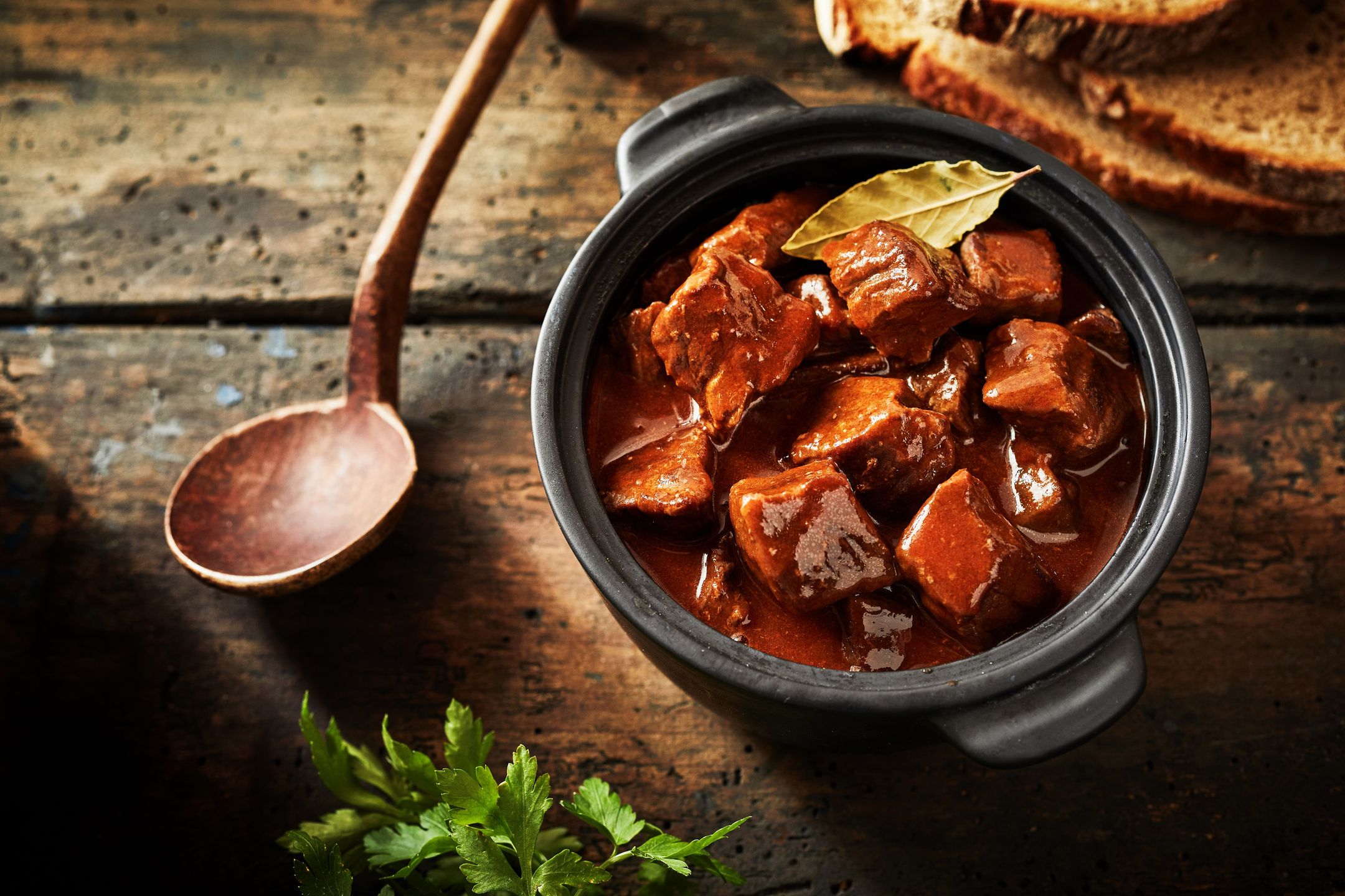 Delicious traditional german cuisine of tasty goulash in a serving size in overhead view 