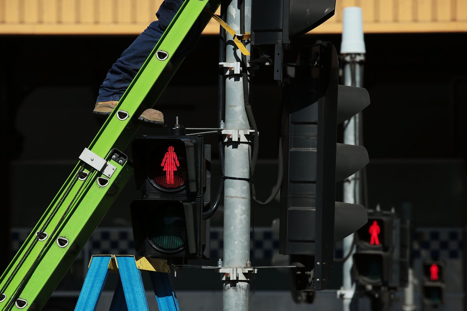 Female traffic light signals are installed at the intersection of Swanston and Flinders streets on March 7, 2017 in Melbourne, Australia. Ten female pedestrian crossing signals are being installed as part of a 12-month trial in an aim to address unconscious gender bias. The Committee for Melbourne, a non-profit organisation comprising more than 120 Melbourne business and community groups, is behind the move.
