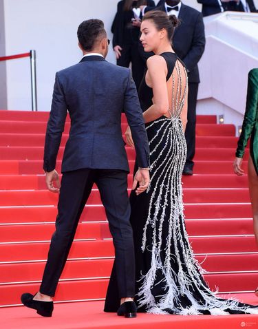 Irina Shayk (w sukni Miu Miu) i Lewis Hamilton, premiera filmu "The Unknown Girl", festiwal w Cannes 2016 (fot. ONS)