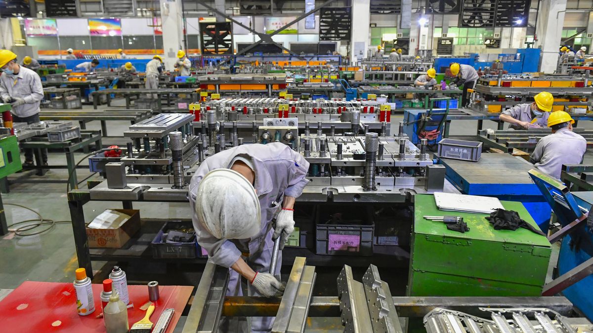 DONGGUAN, CHINA - JANUARY 24: Workers manufacture molds and hardware accessories for new energy vehicles at a factory ahead of the Spring Festival on January 24, 2025 in Dongguan, Guangdong Province of China. (Photo by VCG/VCG via Getty Images)