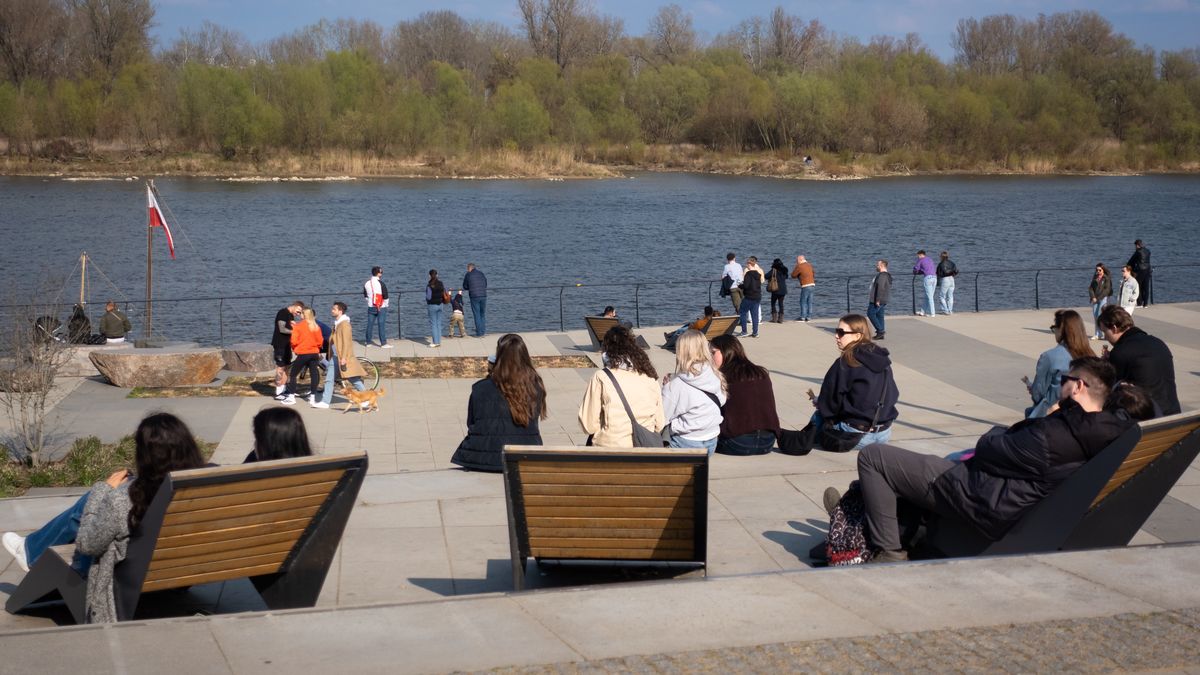 People relax on the Vistula Boulevards near the Copernicus Science Centre in Warsaw, Poland, on March 29, 2026. (Photo by Mateusz Wlodarczyk/NurPhoto via Getty Images)