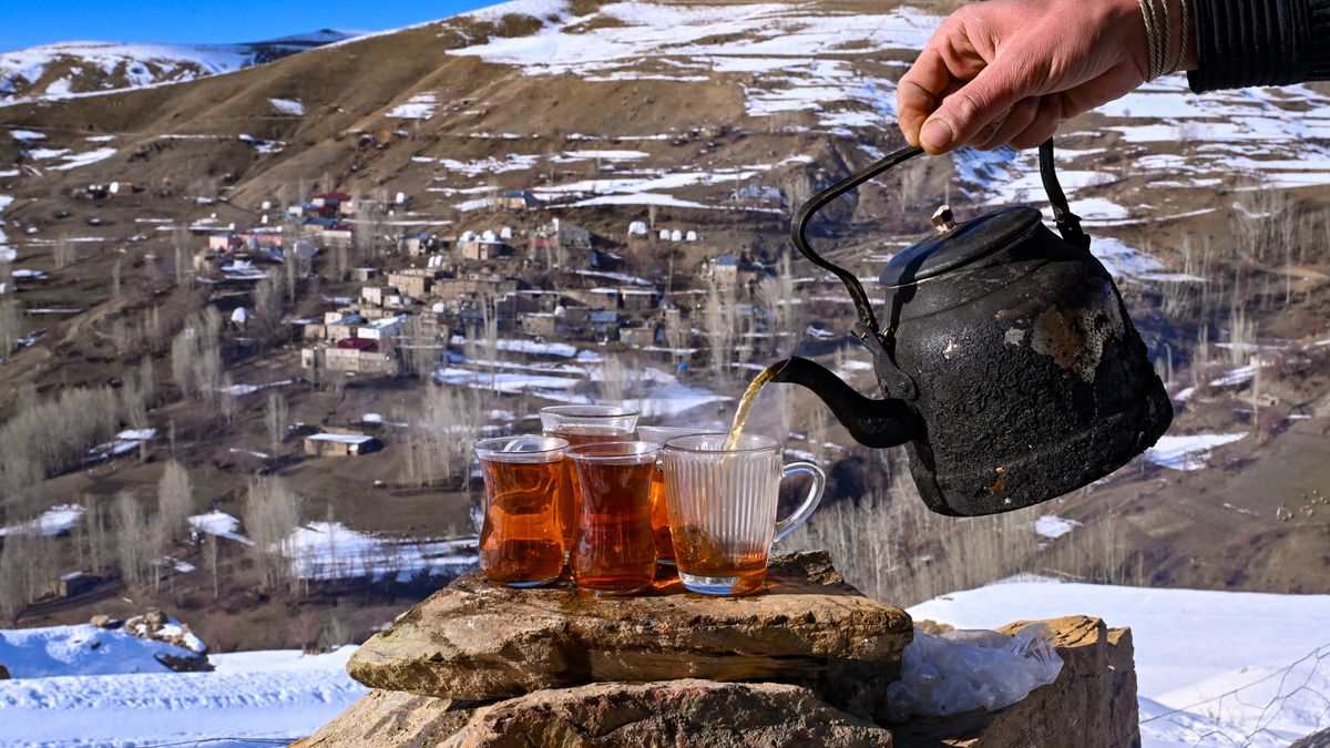 VAN, TURKIYE - DECEMBER 5: Local people spend time with drinking tea outside during sunny winter day in Ozbeyli hamlet, where life gets slow due to harsh condition of winter, of Bahcesaray district, Van, Turkiye on December 5, 2024. (Photo by Ozkan Bilgin/Anadolu via Getty Images)