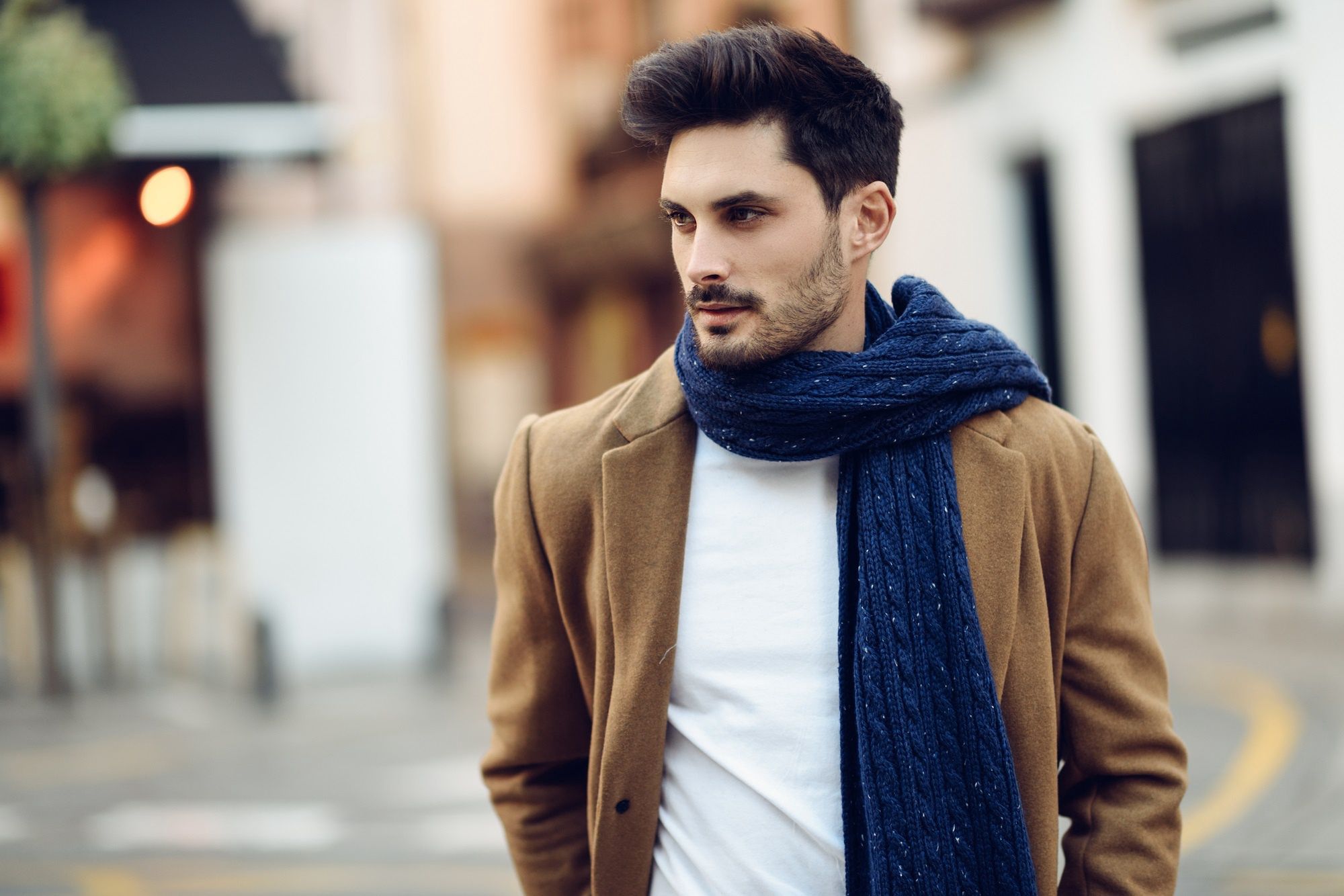 Young man wearing winter clothes in the street. Young bearded guy with modern hairstyle with coat, scarf, blue jeans and t-shirt.Javier Sanchez Mingoranceman, coat, fashion, young, model, handsome, stylish, male, style, portrait, street, urban, elegant, autumn, lifestyle, beautiful, attractive, person, trendy, clothing, beard, caucasian, adult, one, white, guy, confident, formalwear, modern, outdoors, hairstyle, good looking, formal, confidence, fashionable, streetstyle, casual, beauty, city, outside, background, season, jeans, winter, scarf, street style, denim