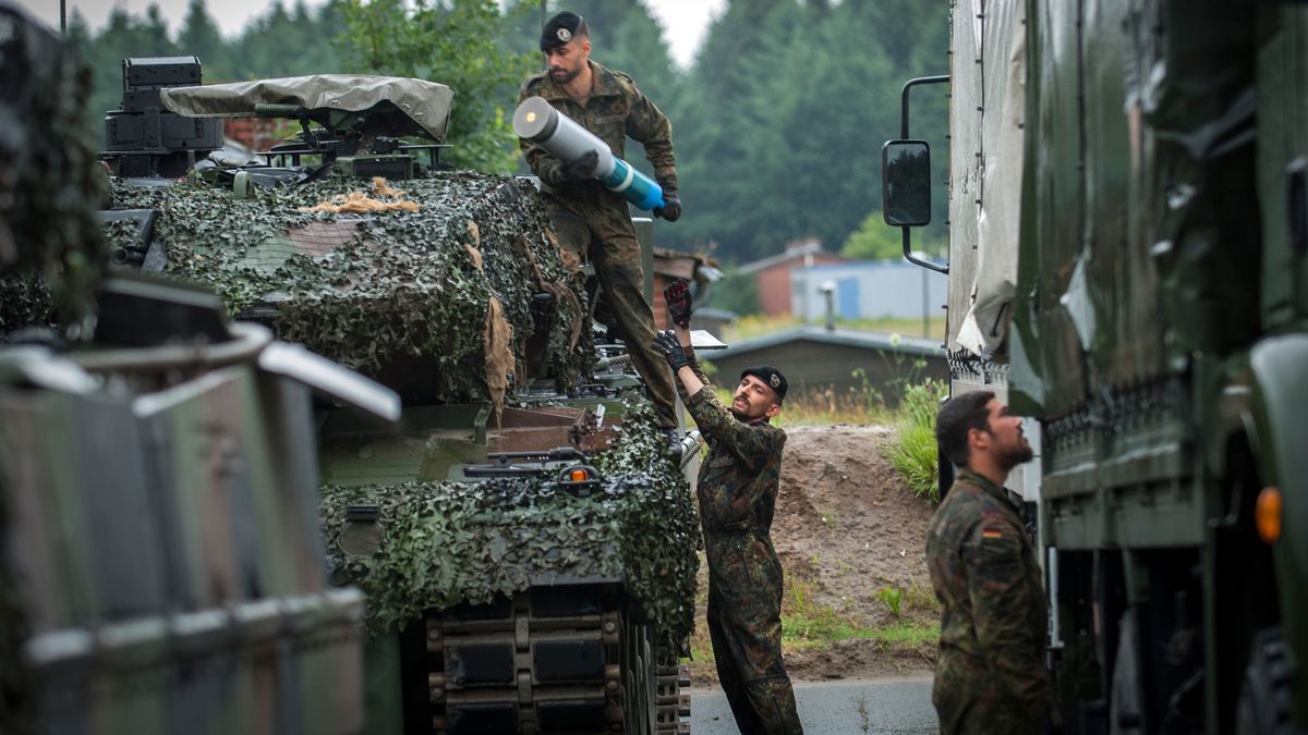 BERGEN-LOHHEIDE, GERMANY - JUNE 21: Soldier's loading tank rounds into a Leopard 2 A6MA2 main battle tank at the Panzerbattalion 414 firing grounds on Lueneburg Heath, Bergen-Lohheide, Lower Saxony, Germany on June 21, 2018. Panzerbattalion 414 (Tank Battalion 414) is Europe's first integrated Battalion made up of Soldiers from 2 nations-Germany and Netherlands. The mixed Battalion of Dutch and German armies, Bundeswehr and Landmacht, operate as mixed crews and is officially part of the Bundeswehr (German Army). One in four out of 400 soldiers in Panzerbattalion 414  are Dutch from the Royal Netherlands Army. (Photo by Craig Stennett/Getty Images)