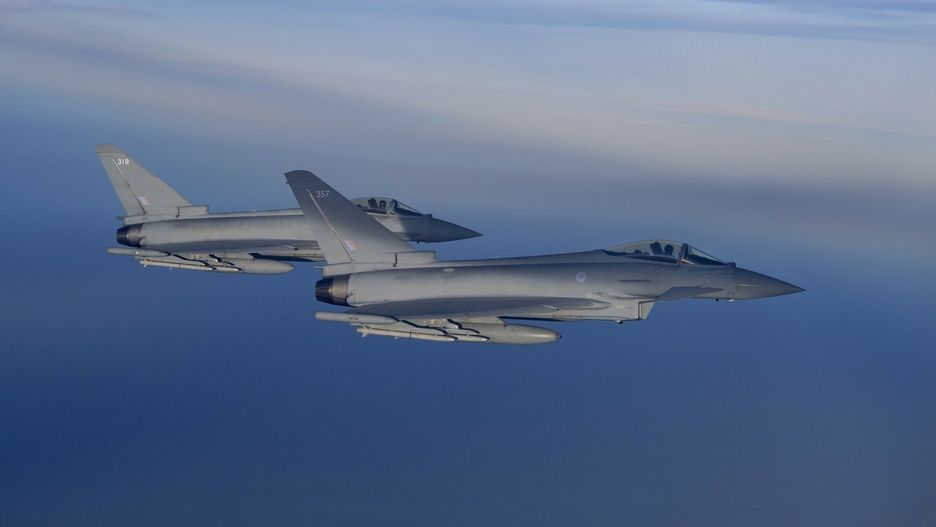 arch38
Two Royal Air Force Eurofighter Typhoon fighter jets from partnering NATO European country Britain  "intercept" a NATO passenger Airbus A-321, right, (from which photos were taken) flying above Europe Tuesday, Jan. 14, 2020, during a simulated mission as NATO held an "Air Policing" flight. Part of NATO's message for the event states that Air Policing is a peacetime collective defense mission, which is at the very heart of NATO's founding treaty. It ensures the integrity of Allies' airspace and protects Alliance nations by maintaining continuous a 24/7 Air Policing within Supreme Allied Commander Europe's (SACEUR's) area of responsibility.
Craig Ruttle/Redux