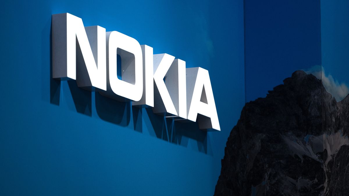 BARCELONA, SPAIN - FEBRUARY 28: A logo sits illuminated outside the Nokia booth at the SK telecom booth on day 1 of the GSMA Mobile World Congress on February 28, 2022 in Barcelona, Spain. The annual Mobile World Congress hosts some of the world's largest communications companies, with many unveiling their latest phones and wearables gadgets like foldable screens.  (Photo by David Ramos/Getty Images)