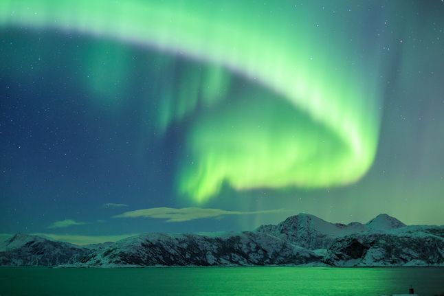 Zorza polarna sfotografowana w okolicach Tromsø w Norwegii.