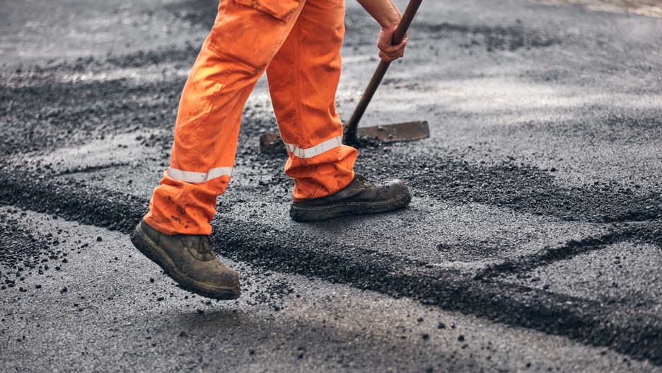 Construction worker working on a new asphalt layer on a public street.Milan Gucic milangucic@gmail.comdigging, level, leveling, asphalt, builder, cement, construction, build, work, worker, concrete, building, industry, job, outdoors, outside, masonry, occupation, structure, mason, tool, repair, man, site, person, manual, working, holding, male, industrial, renovation, reconstruction, craftsman, construct, uniform, guy, fix, fixing, restoration, road, street, public, pavement, sidewalk, road work, shovel, orange, digging, level, leveling, asphalt, builder, cement, construction, build, work, worker, concrete, building, industry, job, outdoors, outside, masonry, occupation, structure, mason, tool, repair, man, site, person, manual, working, holding, male, industrial, renovation, reconstruction, craftsman, construct, uniform, guy, fix, fixing, restoration, road, street, public, pavement, sidewalk, road work, shovel, orange