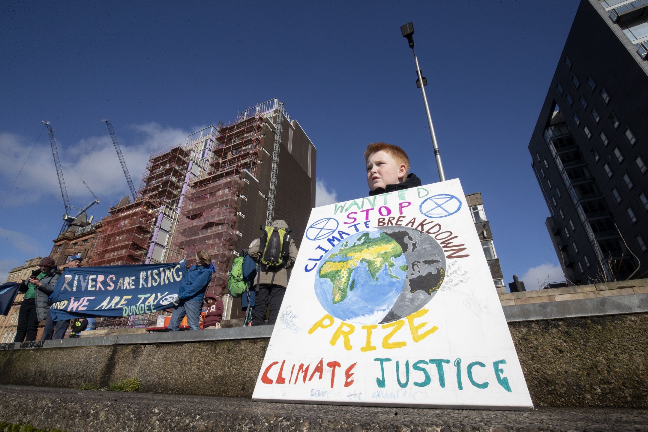 Some of the hundreds of people that took part in the Blue Wave parade organised by Extinction Rebellion through Glasgow city centre to raise awareness of the dangers Glasgow and the world faces from flooding caused by rising sea levels and an increased occurrence of storms. (Photo by Jane Barlow/PA Images via Getty Images)
