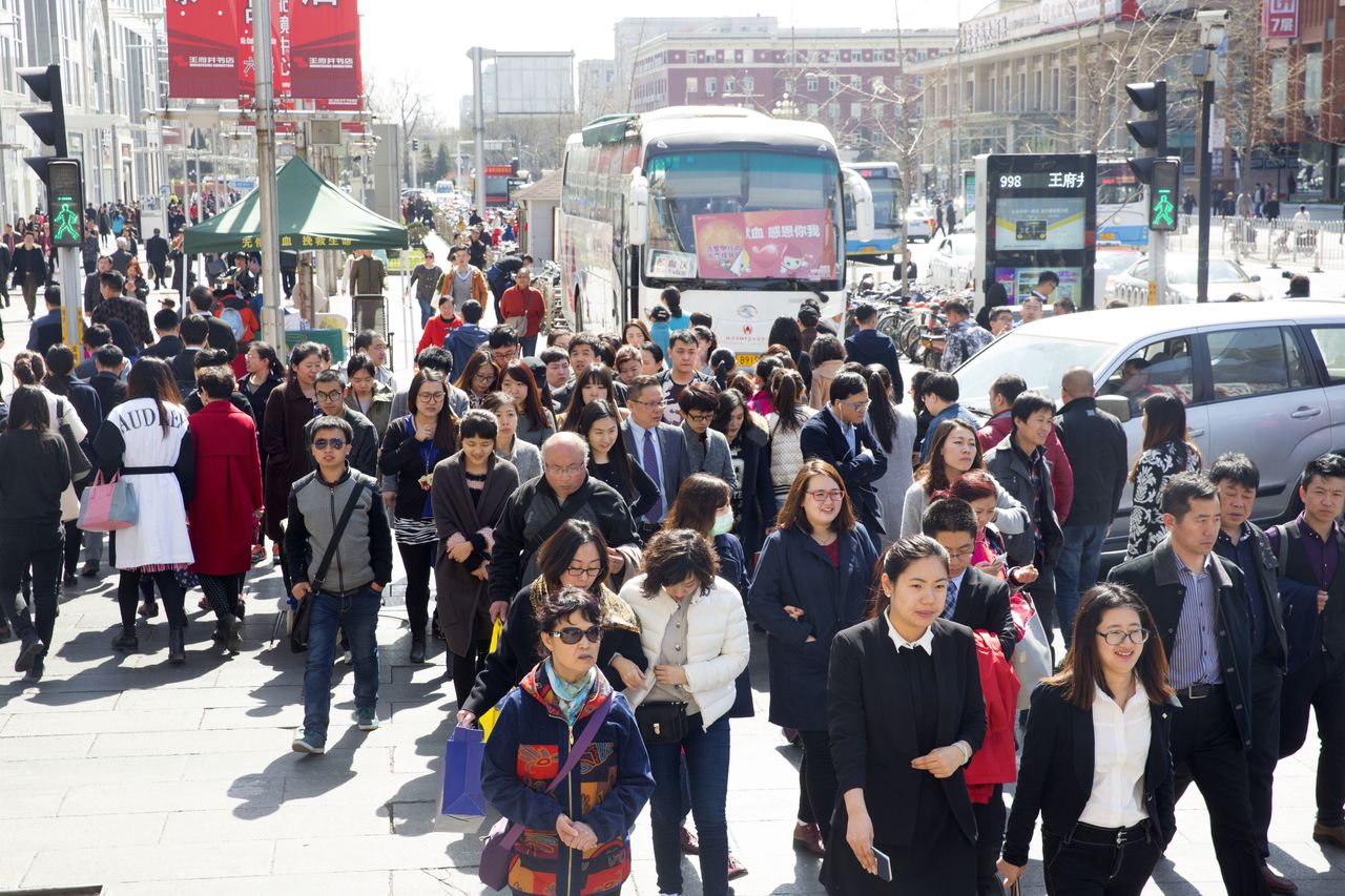 China considers lowering marriage age to 18 to boost births