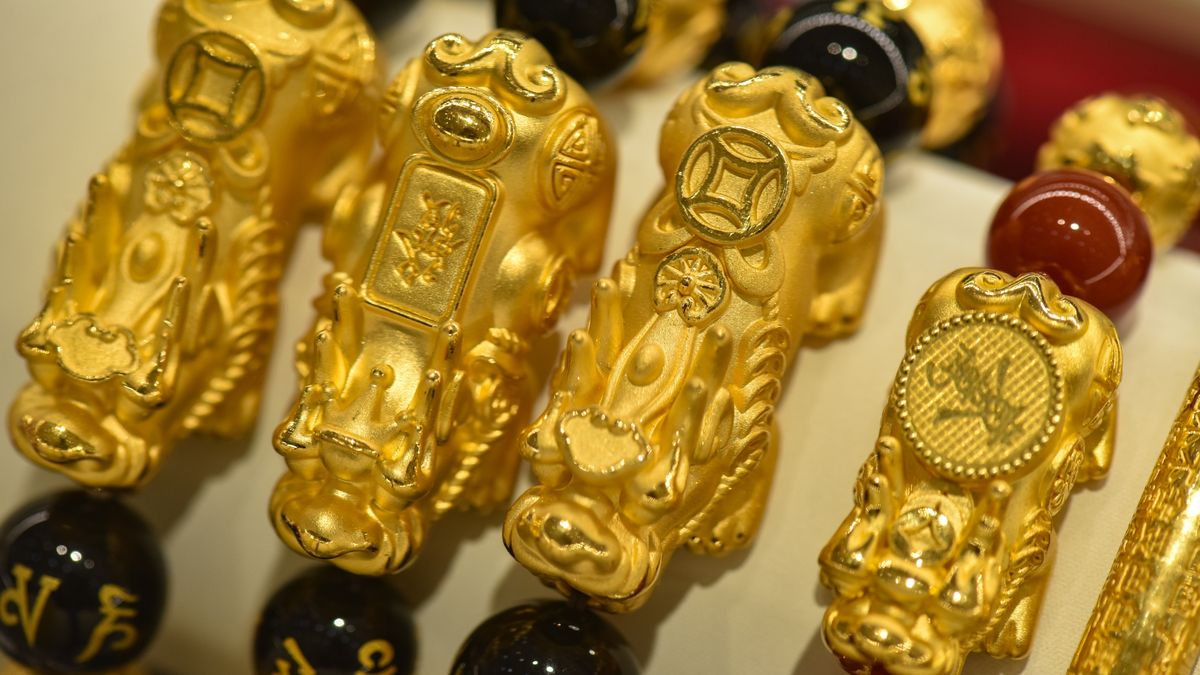 FUYANG CITY, ANHUI PROVINCE, CHINA - 2026/01/31: Intricately carved golden Pixiu charm bracelets, paired with black agate beads, on display at Fuyang Wuyue Mall. (Photo by Sheldon Cooper/SOPA Images/LightRocket via Getty Images)