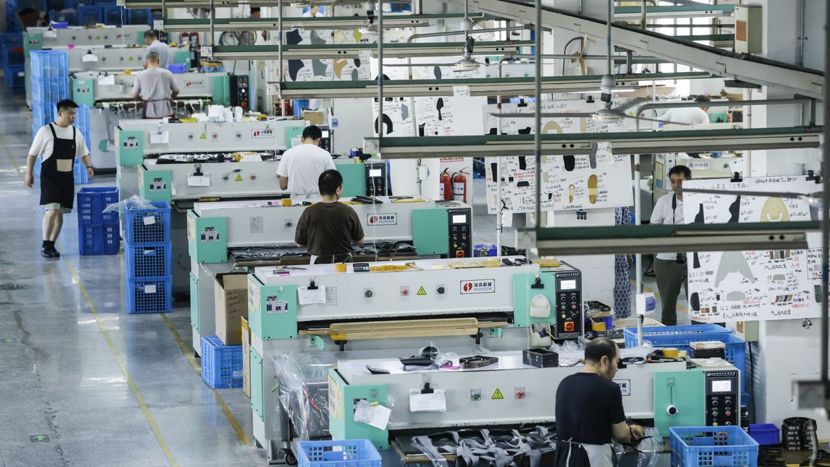 HUAI'AN, CHINA - JULY 19, 2025 - Workers are manufacturing shoes in the workshop of Huading Shoes in Huai 'an City, Jiangsu Province, China on July 19, 2025. (Photo credit should read CFOTO/Future Publishing via Getty Images)