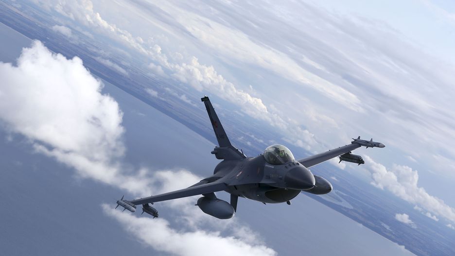 MALBORK, POLAND - AUGUST 27: Turkish F-16 fighter jet pilots fly by C-295M Casa military cargo plane of Poland as F-16 fighter jets of Turkish Air Forces serve in NATO's "Air Policing" mission at 22nd Air Base Command in Malbork, Poland on August 27, 2021. (Photo by Cuneyt Karadag/Anadolu Agency via Getty Images)