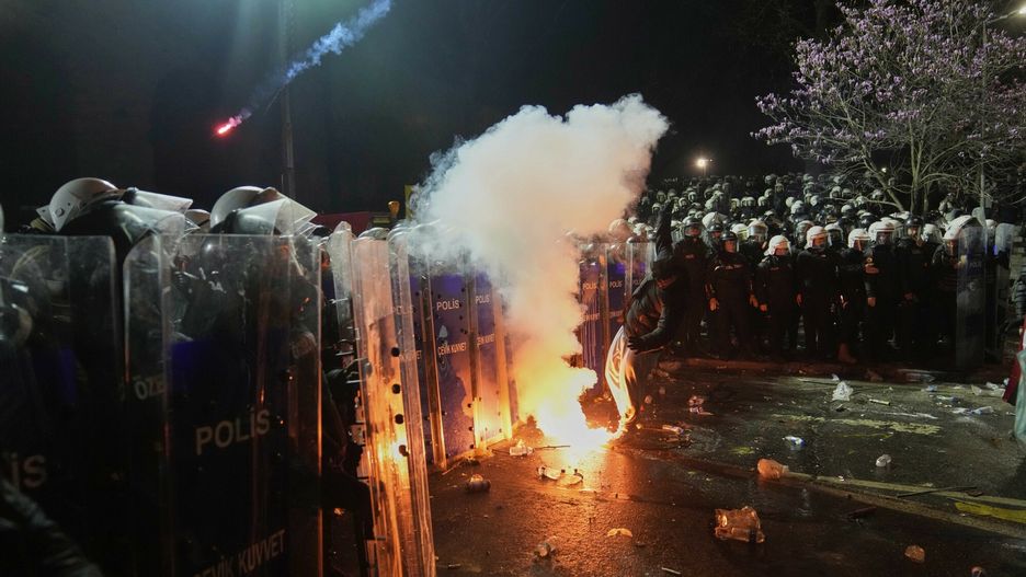 Temporary
A protestor throws a flare towards anti riot police officers during a protest against the arrest of Istanbul Mayor Ekrem Imamoglu, in Istanbul, Turkey, Saturday, March 22, 2025. (AP Photo/Khalil Hamra)
Khalil Hamra