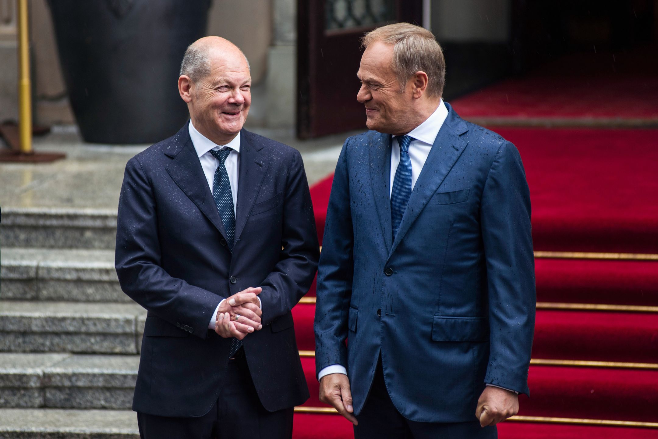 WARSAW, POLAND - 2024/07/02: Prime Minister Donald Tusk (R) welcomes the German Chancellor Olaf Scholz (L) in the PM's Chancellery on Ujazdowskie avenue in Warsaw. Polish-German intergovernmental consultations were held at the Chancellery of the Prime Minister in Warsaw under the chairmanship of Prime Minister Donald Tusk and Chancellor of the Federal Republic of Germany Olaf Scholz. Prime Minister Tusk and Chancellor Scholz, together with their ministers, talked about the security of NATO's eastern flank in the context of the war in Ukraine, the threats related to illegal migration, as well as economic cooperation between the two countries. (Photo by Attila Husejnow/SOPA Images/LightRocket via Getty Images)