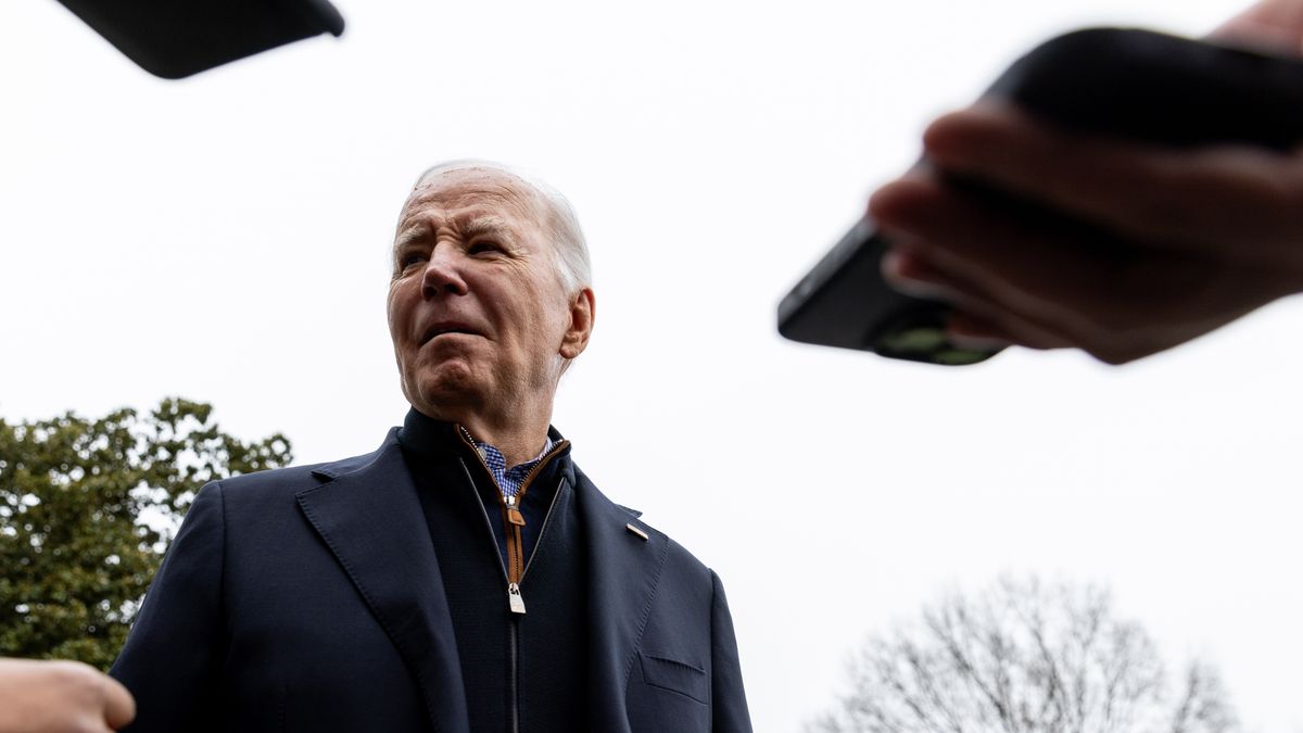 US President Joe Biden speaks to members of the media before boarding Marine One in Washington, DC, US, on Saturday, Dec. 23, 2023. While departing for Camp David, Biden said he "can't think of one" reason presidents should receive absolute immunity from prosecution, as Republican frontrunner Donald Trump has claimed. Photographer: Julia Nikhinson/Bloomberg via Getty Images