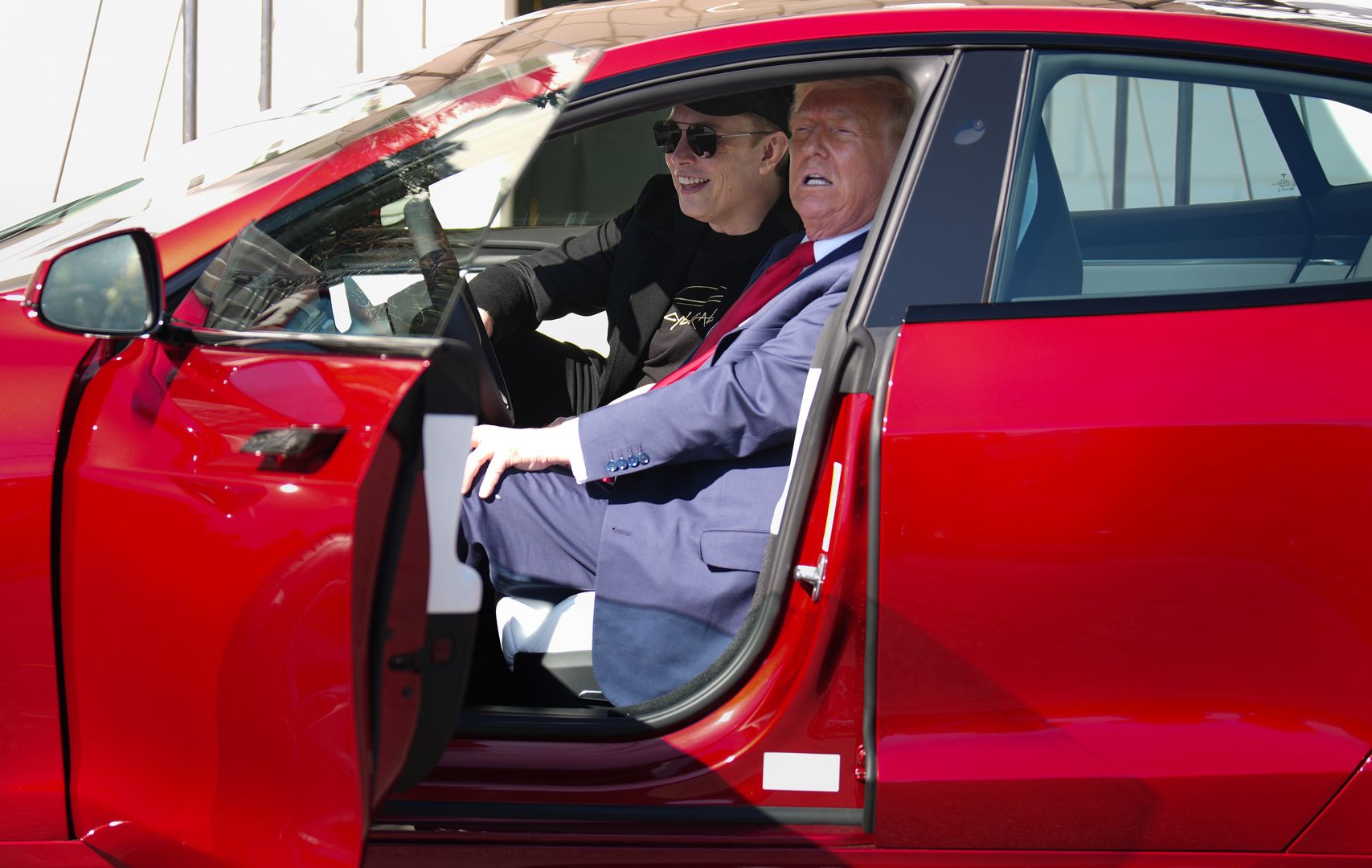 WASHINGTON, DC - MARCH 11: U.S. President Donald Trump and White House Senior Advisor, Tesla and SpaceX CEO Elon Musk sit in a Tesla Model S on the South Lawn of the White House on March 11, 2025 in Washington, DC. Trump spoke out against calls for a boycott of Elon Musk’s companies and said he would purchase a Tesla vehicle in what he calls a ‘show of confidence and support’ for Elon Musk. (Photo by Andrew Harnik/Getty Images)