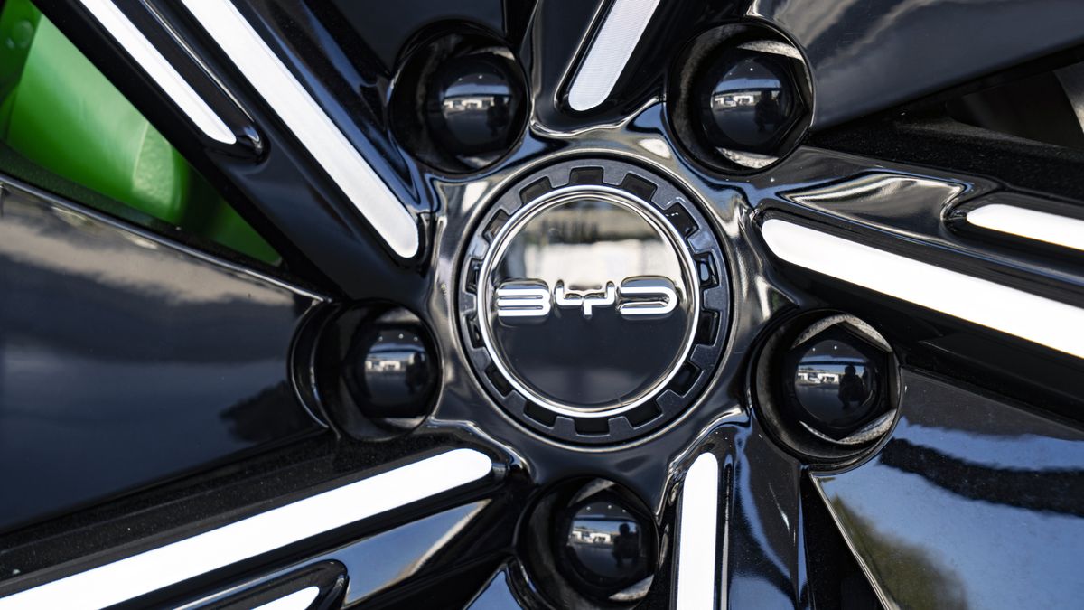 Signage for BYD Co. on a wheel hub of an electric vehicle at the company's headquarters in Shenzhen, China, on Monday, Jan. 15, 2024. BYD, the world's largest maker of electric vehicles, will invest 100 billion yuan ($14 billion) to develop smart-car features, its founder and chief executive officer said Tuesday. Photographer: Qilai Shen/Bloomberg via Getty Images