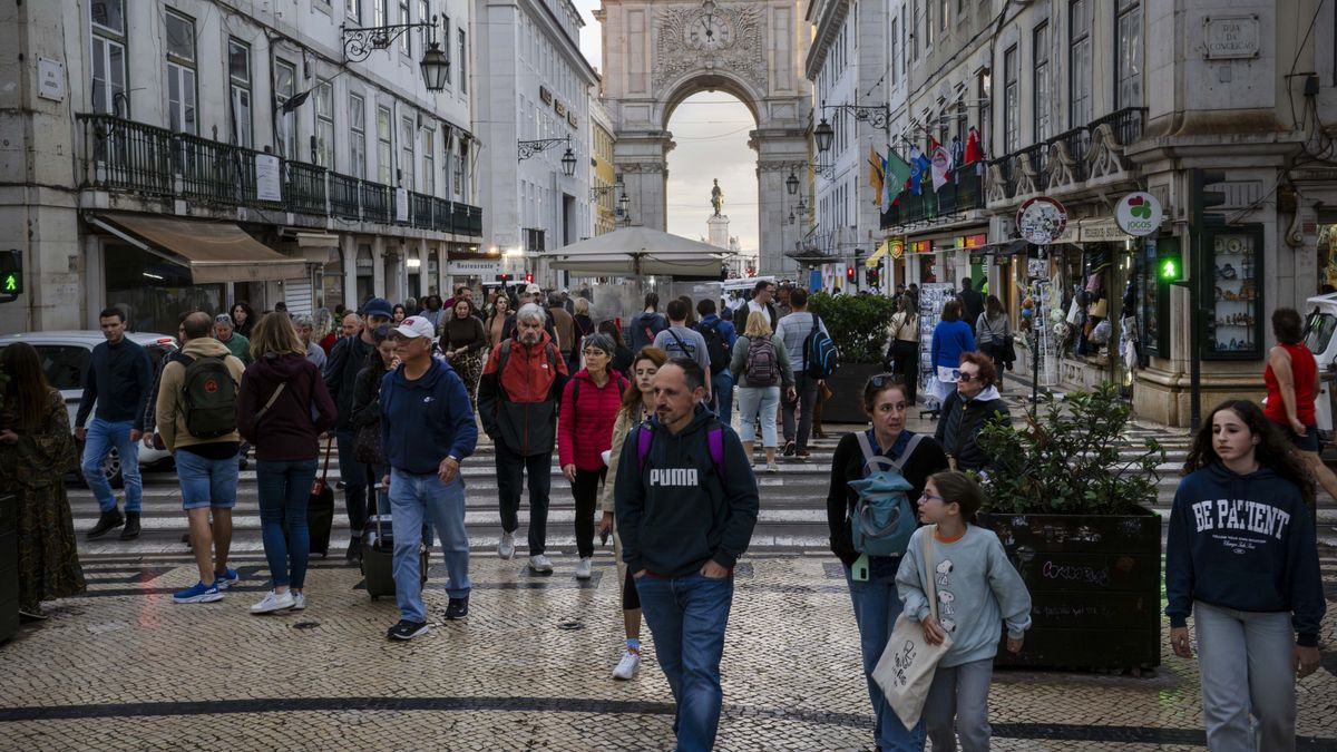 LISBON, PORTUGAL - 2024/10/27: People walk along one of the streets in the historical district of Baixa in Lisbon. (Photo by Jorge Castellanos/SOPA Images/LightRocket via Getty Images)