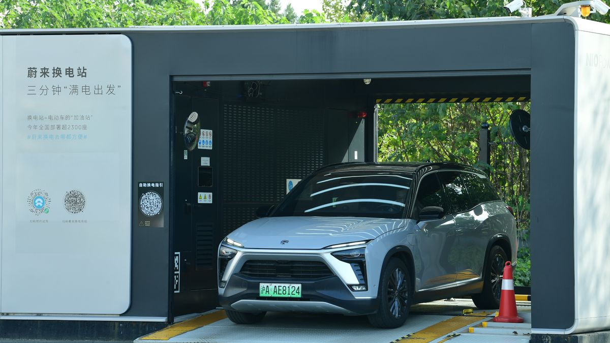 SUZHOU, CHINA - NOVEMBER 13, 2023 - A new energy vehicle changes its battery at NIO Power Station in Shaxi Service Area of ShenyangCHaikou Expressway in Suzhou, Jiangsu province, China, November 13, 2023. Nio has laid out 2,000 change stations in China, 3,281 charging stations, 19,098 charging piles, and 940,000+ third-party charging piles. (Photo by Costfoto/NurPhoto via Getty Images)