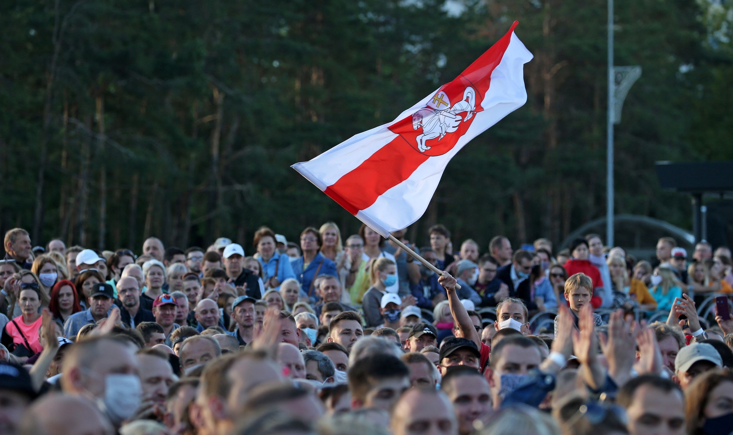 BARYSAW, BELARUS - JULY 23, 2020: People take part in a rally in support of Belarusian presidential candidate Sviatlana Tsikhanouskaya in Gagarina Street. Tsikhanouskaya's election team is joined by Viktor Babariko's election team coordinator Maria Kolesnikova and Valery Tsepkalo's wife Veronika on an election campaign tour across Belarus in support of Tsikhanouskaya. The 2020 Belarusian presidential election is scheduled for August 9. Natalia Fedosenko/TASS (Photo by Natalia Fedosenko\TASS via Getty Images)
