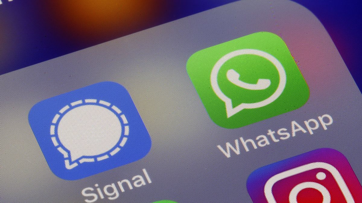 PARIS, FRANCE - JANUARY 11: In this photo illustration, the logos of social media applications, Signal and WhatsApp are displayed on the screen of an iPhone on January 11, 2021 in Paris, France. In recent days, many WhatsApp users have migrated to Signal following the modification of WhatsApp's terms of use concerning personal data. WhatsApp has come under fire since Thursday after asking its nearly two billion users to agree to new terms of service, allowing it to share more data with its parent company Facebook. As a result, the Signal messaging application is experiencing a very strong increase in its subscriptions to the point of undergoing saturation phases. (Photo illustration by Chesnot/Getty Images)