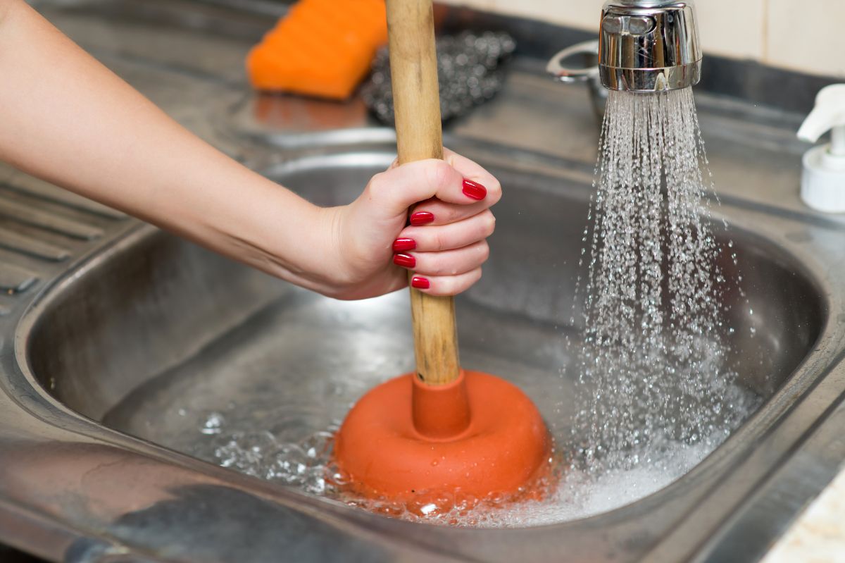 How to unclog a sink using a home remedy?