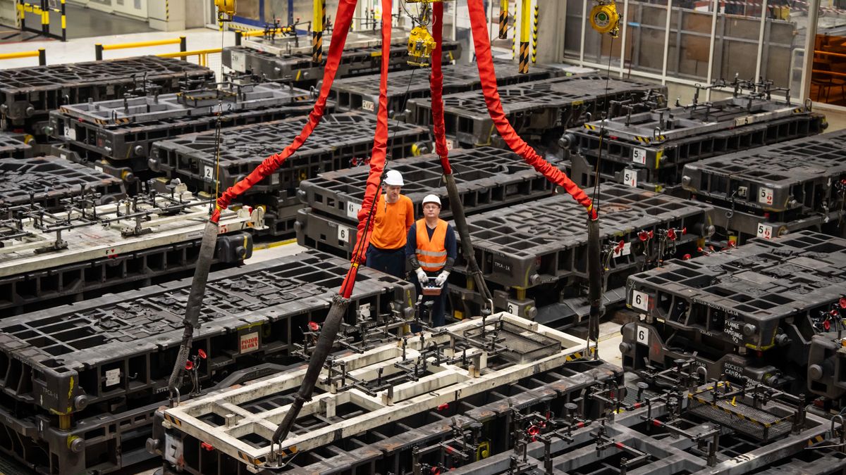 Workers move steel stamping die sets at the Toyota Motor Manufacturing Czech Republic s.r.o. automobile plant in Kolin, Czech Republic, on Monday, Feb. 2, 2026. Toyota kept its title as the world's biggest carmaker for a sixth year, widening its lead over Volkswagen AG by posting record sales despite trade turmoil and growing competition. Photographer: Milan Jaros/Bloomberg via Getty Images