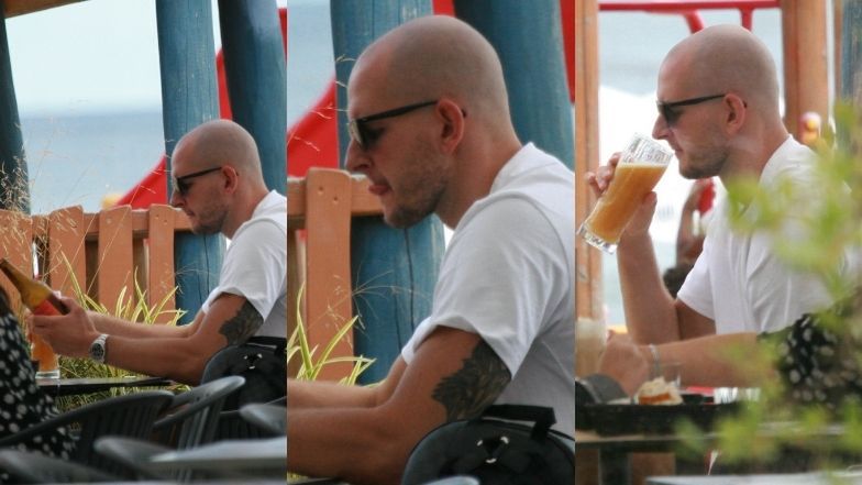 Bartosz Kurek w towarzystwie żony mknie hulajnogą po Sopocie i raczy się zimnym trunkiem