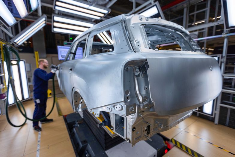 A worker polishes the body of a Mini Countryman automobile at the bodyshop in the BMW Group factory in Leipzig, Germany, on Thursday, March 21, 2024. New-vehicle registrations rose to 995,059 units last month, the European Automobile Manufacturers' Association said Thursday. Photographer: Krisztian Bocsi/Bloomberg via Getty Images