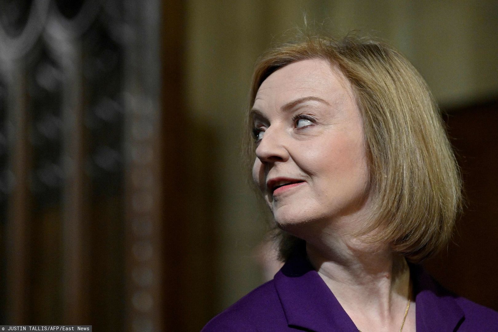 TemporaryBritain's Foreign Secretary Liz Truss reacts as she walks through the Central Lobby at the Palace of Westminster ahead of the State Opening of Parliament at the Houses of Parliament, in London, on May 10, 2022. - Queen Elizabeth II will miss Tuesday's ceremonial opening of Britain's parliament, as Prime Minister Boris Johnson tries to reinvigorate his faltering government by unveiling its plans for the coming year. (Photo by JUSTIN TALLIS / POOL / AFP)JUSTIN TALLIS